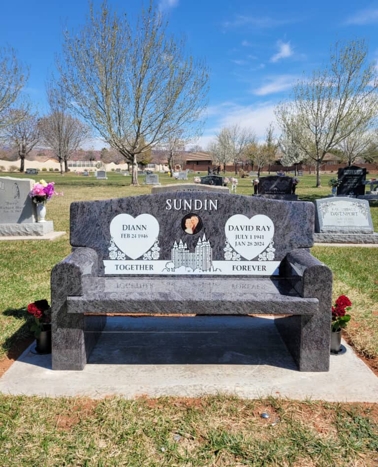 Memorial bench engraved with Sundin family name and names of Diann and David Ray, located in a cemet.